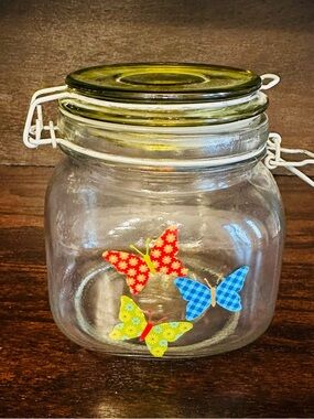 Glass Storage Jar with Green Lid and Butterfly Accents